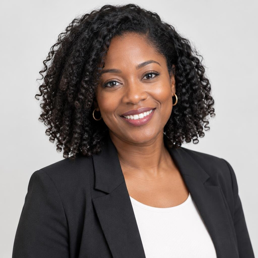 Portrait of a smiling woman with dark curly hair